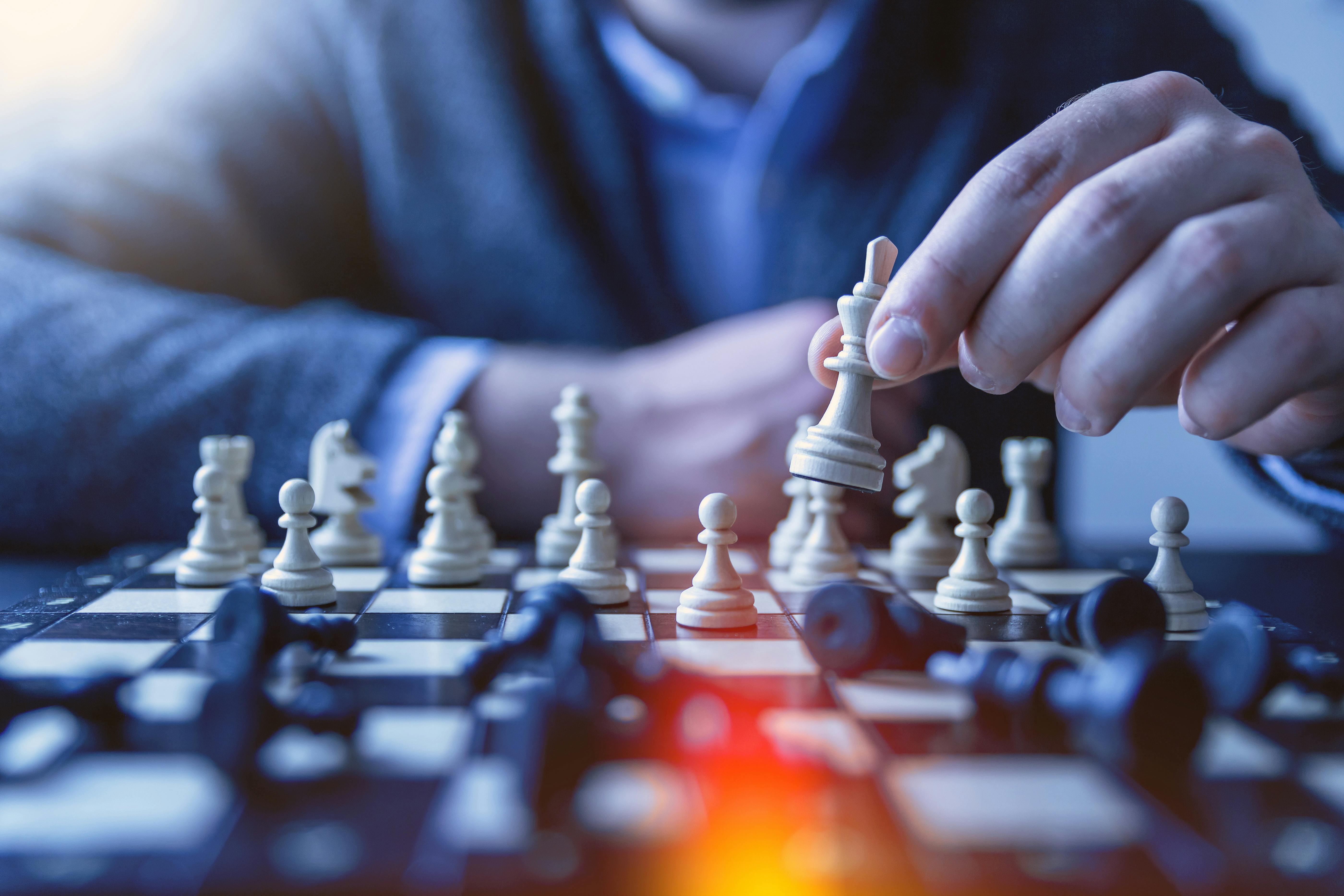 pexels-jeshootscom-1040157 A person playing chess.