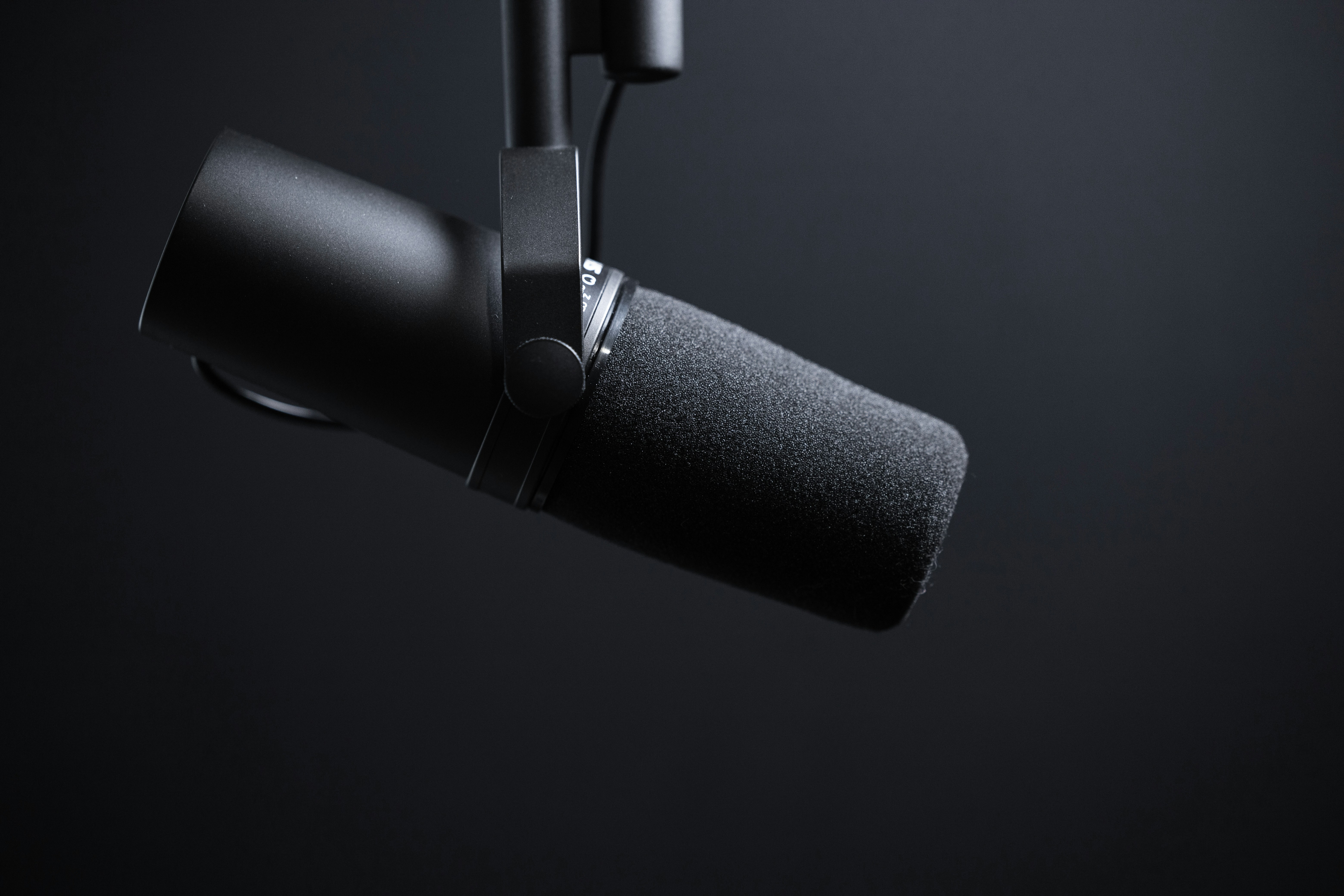 jukka-aalho-_t9c-kmMjl8-unsplash A podcast microphone.